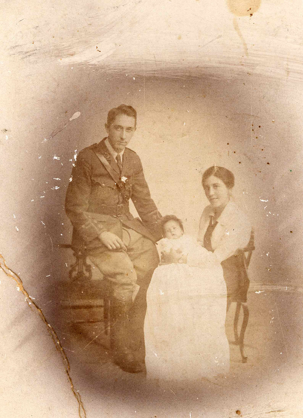 Ynys Fraser at her christening in 1917 in the church army hut in Hornchurch, the baby Ynys wears the gown her father bought in Bond Street, London. 
