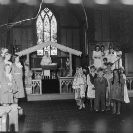 Mrs Marshall package to children during rehearsal of Holy Trinity pageant