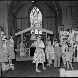 Mrs Marshall package to children during rehearsal of Holy Trinity pageant