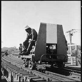 Completing repairs on the railway bridge over Victoria Street, Waihī, after it was struck by a road crane.