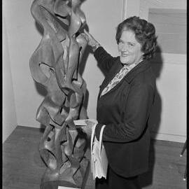 Sculpture by Jon Freeland of Mount Maunganui, inspected by his mother Mrs O. P. Smith, at the Tauranga Art Society Gallery.
