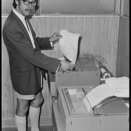 Bay of Plenty Times sub-editor Mr Louis Edwards using newly-installed teleprinters.