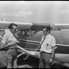 Two men with small aircraft