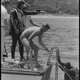 Diver emerges at the stern of "Reo"