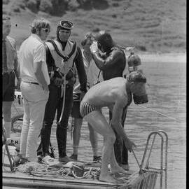 Diver emerges at the stern of "Reo"