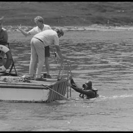 Diver emerges at the stern of "Reo"