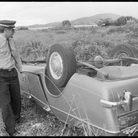 NZ Police and flipped car