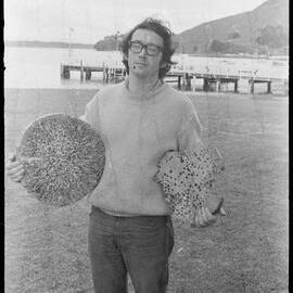 Ship worms held by Mr J. L. McKay