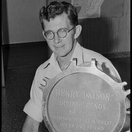 Henry Laison plaque held by Brian Tetley