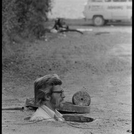 Mr Bryan Neal of Tauranga inspecting sewage system