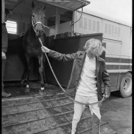 Jockey Kevin Scott unloading an unamed colt