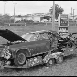 Car wreck used as a display for Waihī Panel Works Ltd