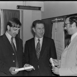 Messrs D. J. Harvey (left) and C. W. Railton (right) with Mr E. A. Craig