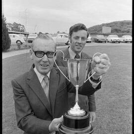 Mr Maguiness (left) and Mr Gibbs with the new anti-litter cup