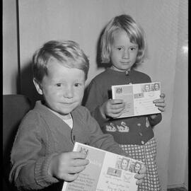 Two kids with Royal Wedding envelopes 