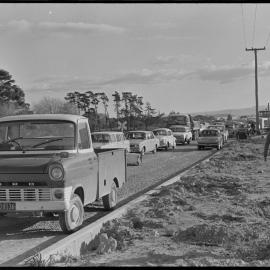 Drivers wait in traffic after accident