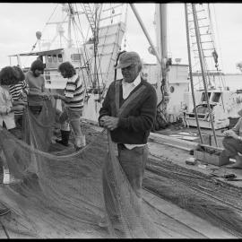 Repairing trawler fishing net