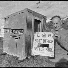Mr J. P. Sklenars with the former Whakaangiangi Post Office.