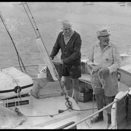Galvanised metal brackets that support power lines where they enter buildings.