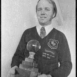 Indoor bowls. Graeme Dunlop with the New Zealand Indoor Bowling Federation's singles trophy for 1973.