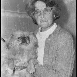 Mrs M. J. Cooper with her recently-arrived Pekinese Tommy.