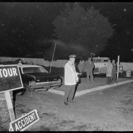 Traffic officer supervising the closure of the Tauranga-Hamilton highway near Barkes Corner after a spill of about 2,000 gallons of tallow.