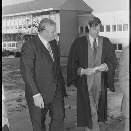 Prime Minister Norman Kirk with (principal Mr N. D. Morris?) during a visit to Tauranga Boys' College.