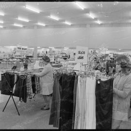 Retailing. Feminine apparel is a trendy and extended section of the new Farmers complex.