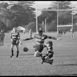 Rugby. Gavin McLauchlan (Cadets) is checked by Greerton centre Ash Brown.