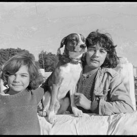Patrick and Marc Farge with their dog Leemor on board the family's trimaran.