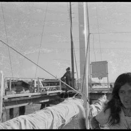 France Farge (?) on board the family's home-made trimaran in the Port of Tauranga.