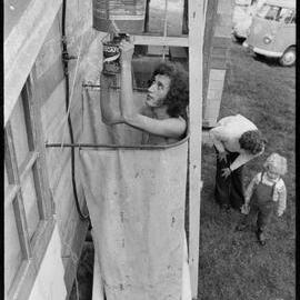 Time for a shower using hot water from the wood stove at the Farm at Tamata a Taihuka.