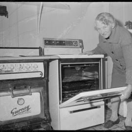 Mrs A. Johanson wins a new electric stove for having the oldest one still working in Tauranga.