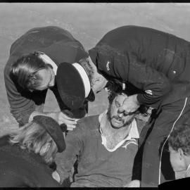 Rugby. Mount captain Bruce Matuschka being treated for a head injury.