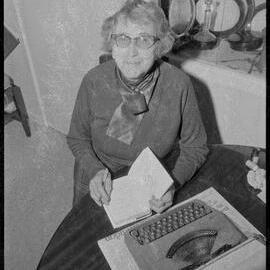 Mrs Doris Wallace autographing a new edition of her books.