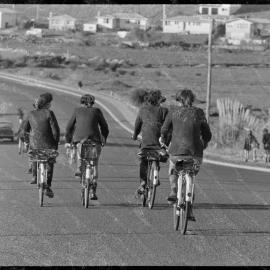 Three abreast riding illegal. Schoolboys riding home [on Ngātai Road?]