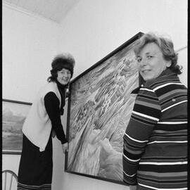 Hanging paintings for the Tauranga Art Society's exhibition.