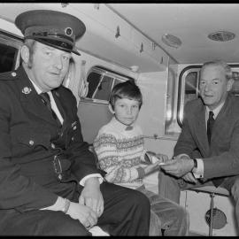 David Abernethy handing his family's donation to Tauranga St John Ambulance Association president Mr E. L. Faulkner.