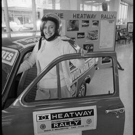 Miss Pauline Jowsey with a display in the Bank of New Zealand about the Heatway Rally about to pass through Tauranga.
