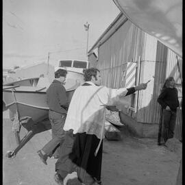 Father W. R. Fletcher blessing a newly-built fishing boat.