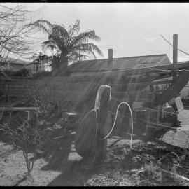 Captain Len Anderson building a half-size replica of the Tauranga scow Alma in his backyard.