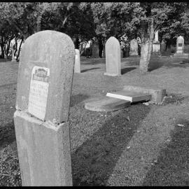 Vandalised headstones at the Mission Cemetery.