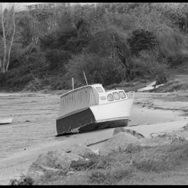 Launch The Drifter, blown off her moorings at Ōmokoroa by recent high winds.