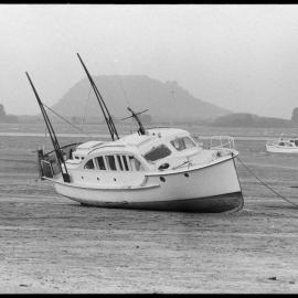 Launch Kingfish, blown off her moorings at Ōmokoroa by recent high winds.