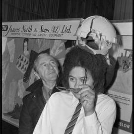 Safety education officers with the Department of Labour touring an exhibition to encourage industrial safety.