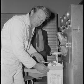 Mr R. Alderson producing Devon Icecream at Te Puke's dairy factory.