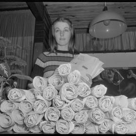 Lorraine Oliver, receptionist at Tauranga Public Relations Office, posting newspapers to Britain.