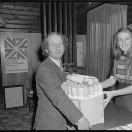 Lorraine Oliver, receptionist at Tauranga Public Relations Office, and Peter Clark, public relations officer, posting newspapers to Britain.