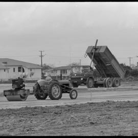 Placing filling sand for the foundations of the Ōtūmoetai Trust Hotel.