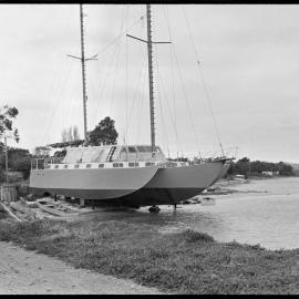 Trimaran La-Ron nearing completion on the beach adjacent to Aerodrome Wharf.
